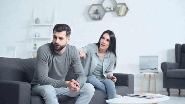 displeased woman quarreling with man at home  - Filmagem, Vídeo