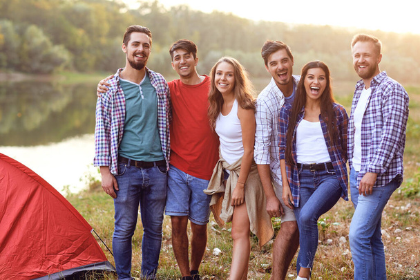 Group of people smiling standing on a picnic - Foto, imagen