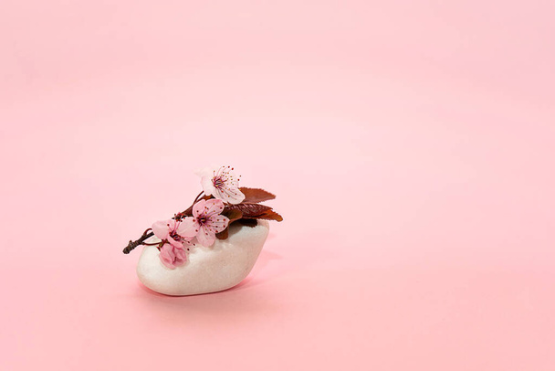 Spring cherry flower on top white stone. Cherry blossom. - Fotó, kép