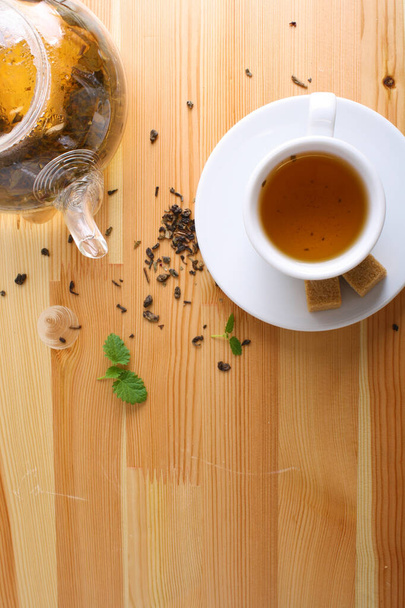 tea cup teapot sugar wooden background - Zdjęcie, obraz