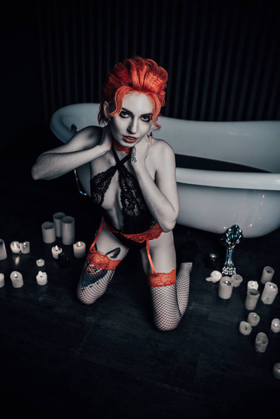 Vampire in underwear in a blood bath - Foto, immagini