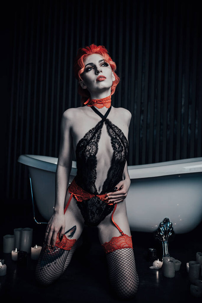 Vampire in underwear in a blood bath - Photo, Image