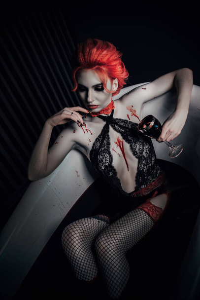 Vampire in underwear in a blood bath - Fotoğraf, Görsel