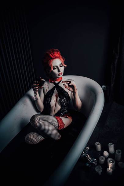 Vampire in underwear in a blood bath - Foto, imagen