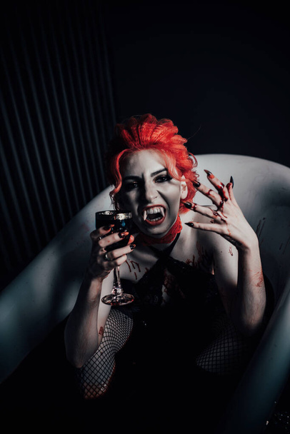 Vampire in underwear in a blood bath - Foto, afbeelding