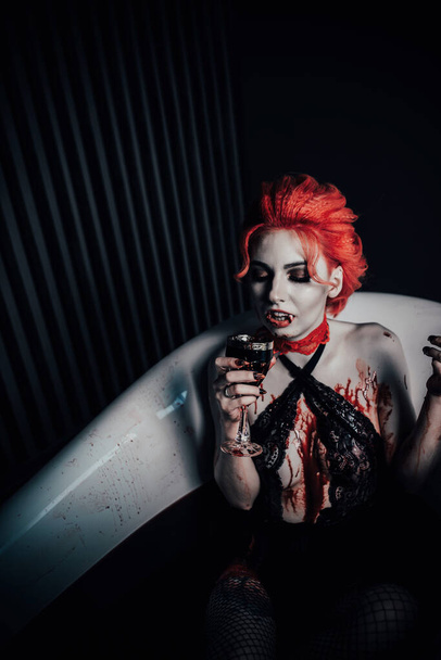 Vampire in underwear in a blood bath - Foto, Bild
