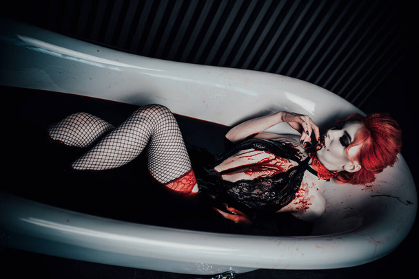 Vampire in underwear in a blood bath - Фото, зображення