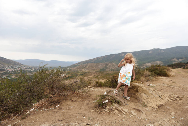 cute little girl in the mountain landscape - Foto, Imagem