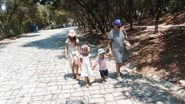 Granny with kids walking in the park - 写真・画像