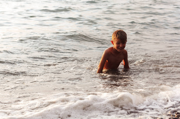 boy standing in the water - Fotó, kép