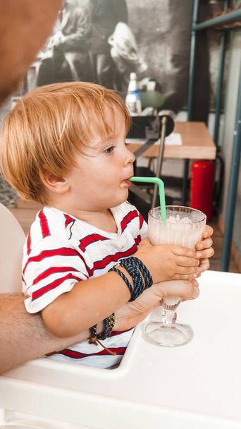 little boy with a glass of milk  - Valokuva, kuva