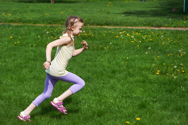 Little girl jumping, running - Fotó, kép