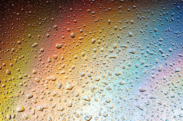 Abstract drops on a rainbow, can be used as a background. Concept, abstract art - 写真・画像