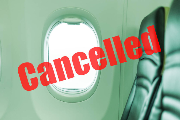 Flight cancelled. Coronavirus, red warning sign with text cancelled Flight in empty airplane cabin. Cancelled flight, no travel, stop airline for prevention coronavirus pandemic. COVID19 quarantine. - Foto, Imagem