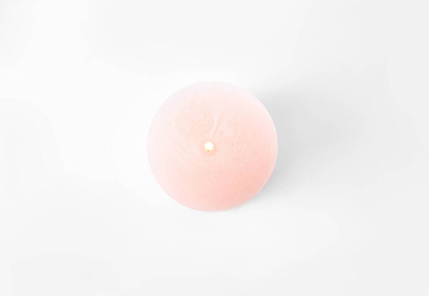 Burning pink candle isolated on white, top view - Valokuva, kuva