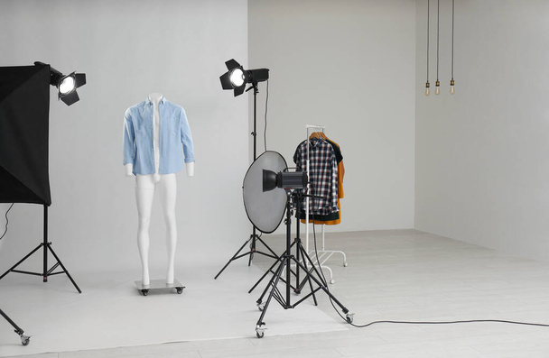 Ghost mannequin with modern clothes in professional photo studio - Foto, Imagem