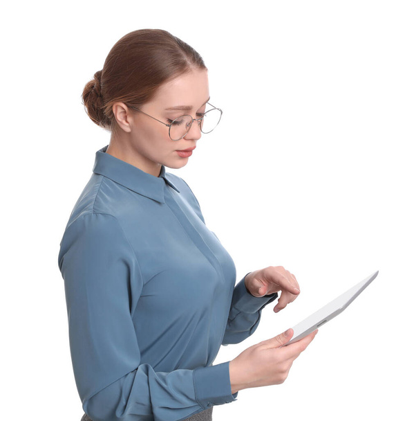 Young businesswoman with tablet on white background - Foto, immagini