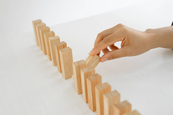 Hand holding blocks wood game, Concept Risk of management and strategy plan, growth business success process and team work. - Photo, Image
