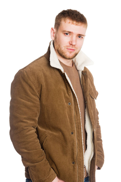 Portrait young European man in a winter jacket. Isolated on white. - Foto, Bild