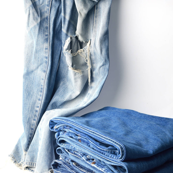 Jeans trousers stack on white background - Photo, Image