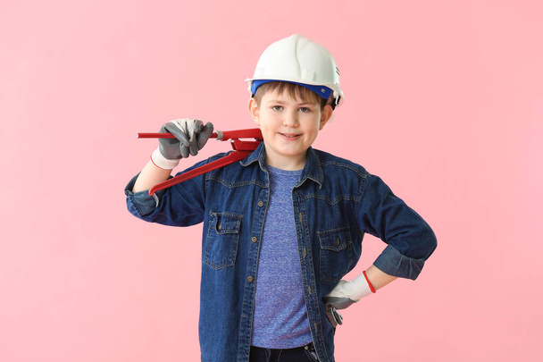 Cute little builder on color background - Photo, Image