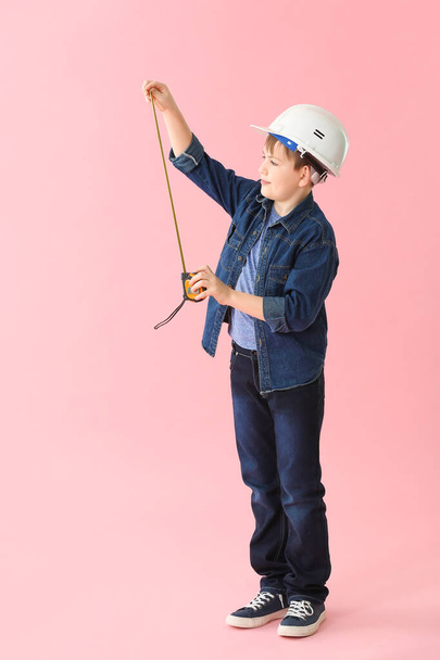 Cute little builder on color background - Photo, Image