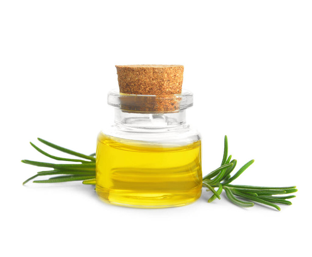Bottle of rosemary essential oil on white background - Фото, изображение