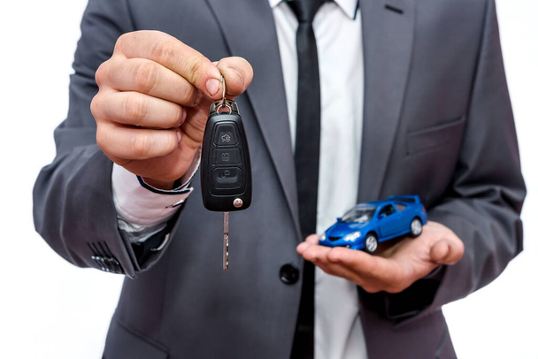 Man holding toy car and keys isolated on white - Photo, Image