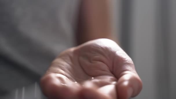Protection from germs concept. Antibacterial sanitizer applied on hands. Covid-19 - Materiał filmowy, wideo