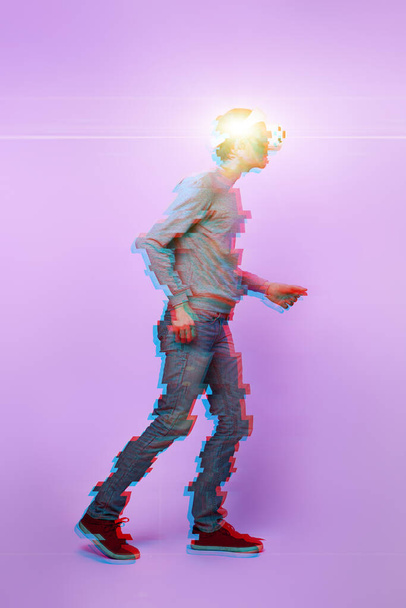 Man is using virtual reality headset. Image with glitch effect. - Foto, immagini