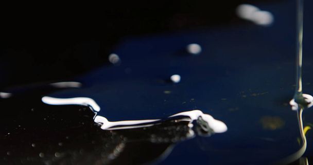 The waves on the water diverge in a circle, a drop of water - Photo, image