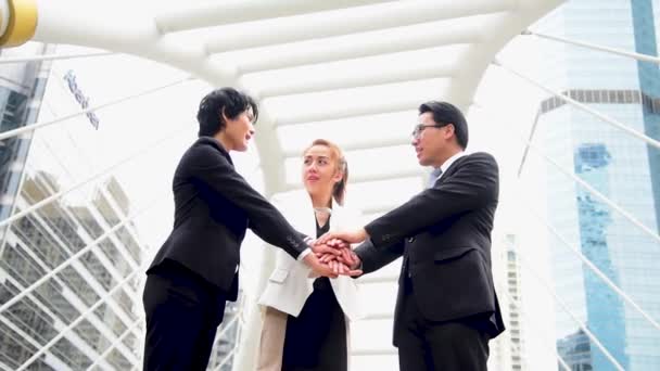 Group of asian business people shake hands and talking in city. Diversity people partner business meeting brainstorming together with businessman trust teamwork. Collaboration Team Meeting concept - Footage, Video