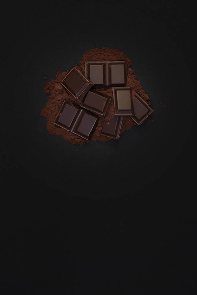 Dark chocolate on a dark background - Fotó, kép