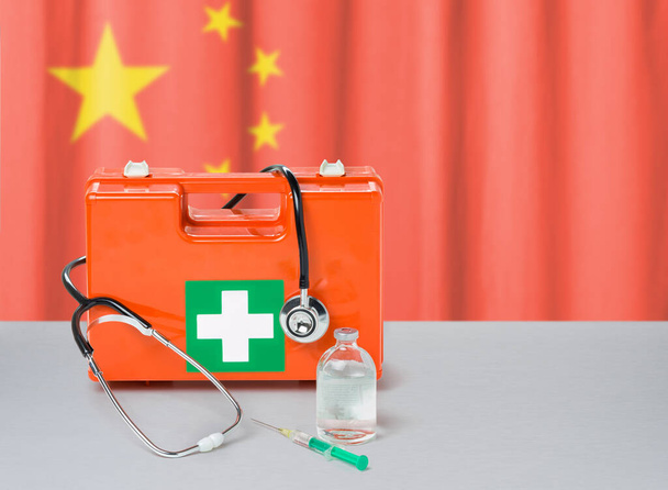 First aid kit with stethoscope and syringe - China - Foto, afbeelding