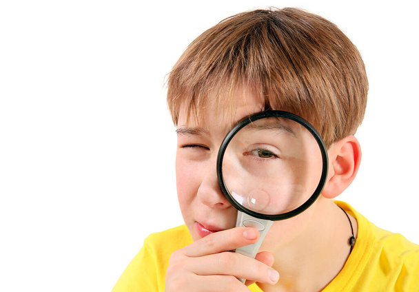 Curious Kid with Magnifying Glass Isolated on the White Background - Fotografie, Obrázek