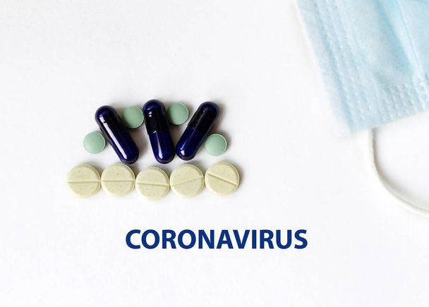 New coronavirus. Protective medical mask and medicines, pills for virus mercury thermometer, syringe. Chinese coronavirus outbreak. - 写真・画像