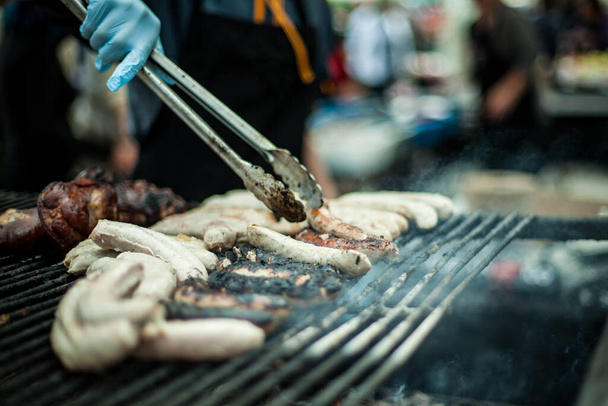 Grilling sausage, street food at market - Photo, Image