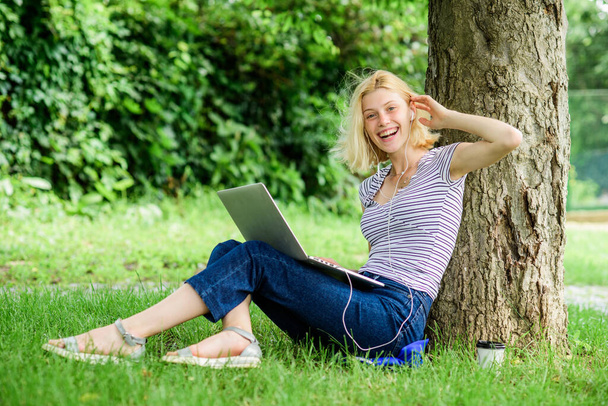 Nature is essential to wellbeing and ability to be productive and high functioning at work. Reasons why you should take your work outside. Work in summer park. Girl work with laptop in park - Foto, Imagem
