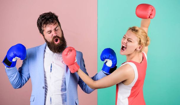 Man and woman boxing fight. Couple in love competing in boxing. Conflict concept. Family quarrel. Boxers fighting in gloves. Domination concept. Gender battle. Gender equal rights. Gender equality - Foto, afbeelding