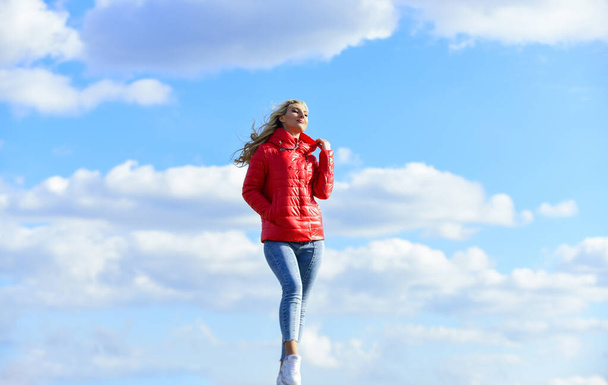 woman on blue sky background. woman in model pose outdoors. feel free. woman enjoying weather outdoors. Freedom and expectation. Beauty and fashion, look. concept of loneliness. Feeling flirty - Φωτογραφία, εικόνα