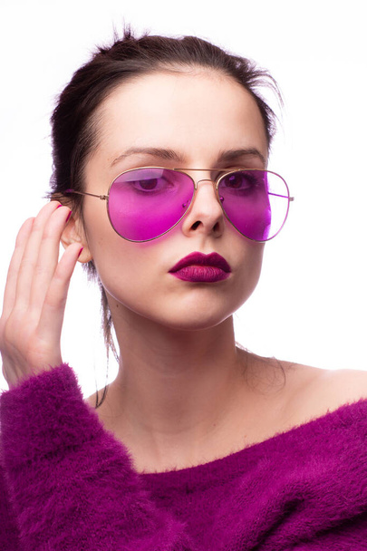 girl in a purple sweater, purple glasses with purple lipstick on her lips - Photo, Image