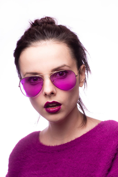 girl in a purple sweater, purple glasses with purple lipstick on her lips - Photo, Image