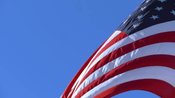 Copy space on a blue sky background. USA flag - Footage, Video