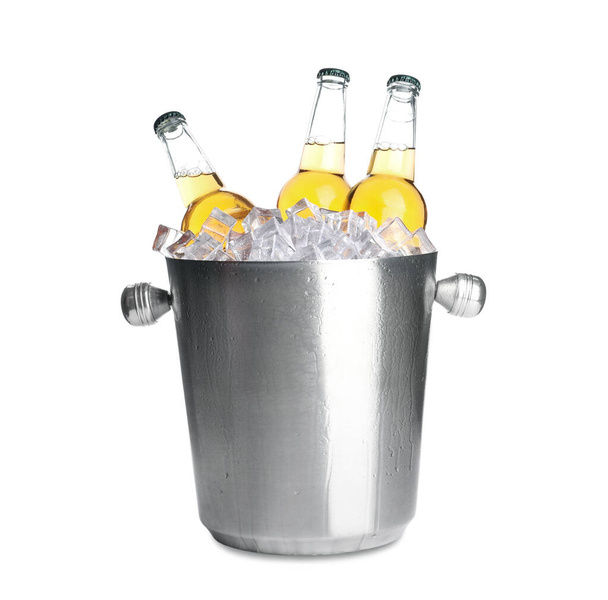 Metal bucket with bottles of beer and ice cubes isolated on white - Foto, imagen