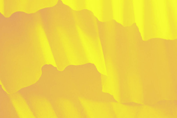 Vivid yellow gradient background with paper waves - Photo, Image