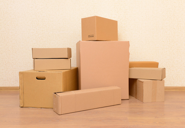 Empty room with stack of cartons: moving house concept - Φωτογραφία, εικόνα