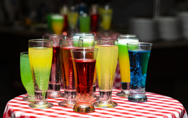 Glasses with a cocktail. Multicolored drinks. Drunk party. - Photo, Image