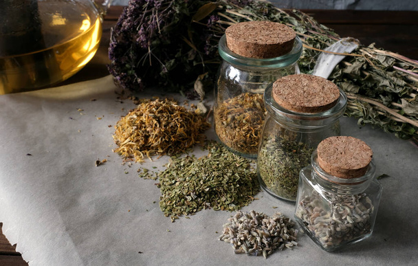 Homemade apothecary. Natural herbs medicinal. Dried herbs in glass jars. Various kinds of herbal tea. - Fotó, kép