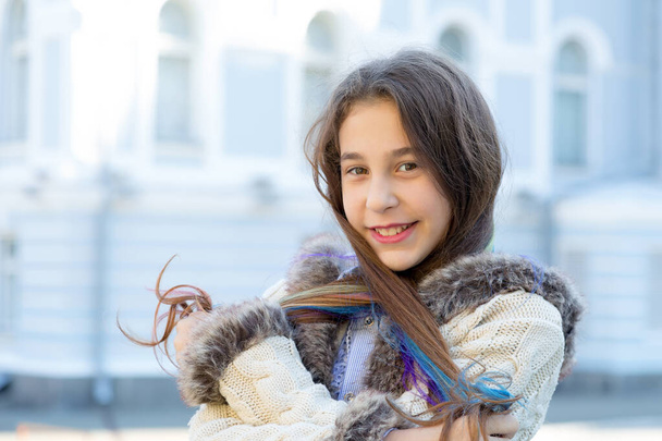 Portrait of young happy girl on city street background. - Fotografie, Obrázek