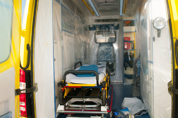 ambulance with medical bed for pandemic or virus crisis - Фото, изображение